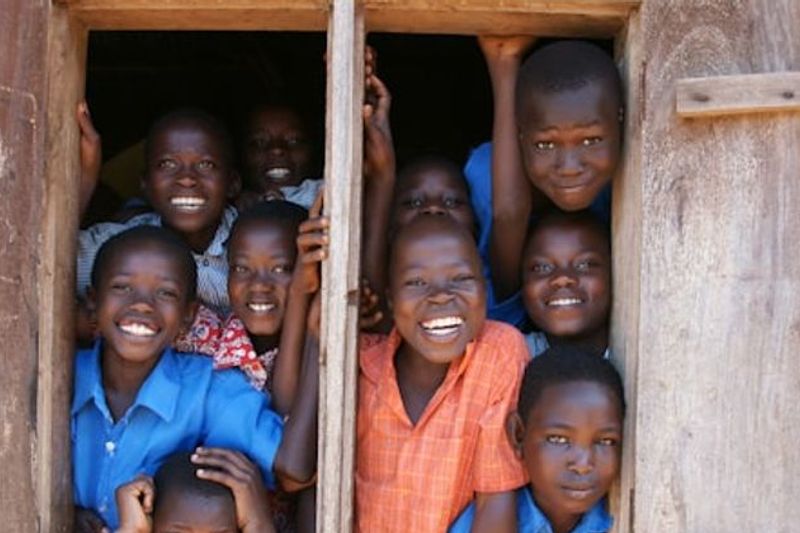 Children smiling together in Kasanje Uganda — Tender Mercies International